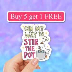 May include: A white goose wearing a chef's hat is stirring a pot with a wooden spoon. The text on the sticker reads "On my way to stir the pot".