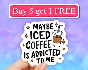 May include: White sticker with black text that reads "Maybe iced coffee is addicted to me". A cartoon drawing of a cup of iced coffee with a straw is next to the text. There are small stars around the text and cup.
