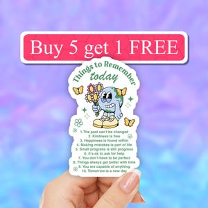May include: A green and blue sticker with a cartoon Earth holding flowers and butterflies. The sticker says "Things to Remember Today" and lists 10 things to remember, including "Kindness is free" and "Tomorrow is a new day".