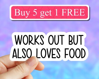 May include: White sticker with black text that reads "Works out but also loves food". A hand is holding the sticker. A pink and blue background with a white banner that reads "Buy 5 get 1 FREE" is behind the sticker.