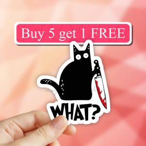 May include: A black cat holding a bloody knife with the text "WHAT?" in white letters. The background is pink with a white banner that says "Buy 5 get 1 FREE".