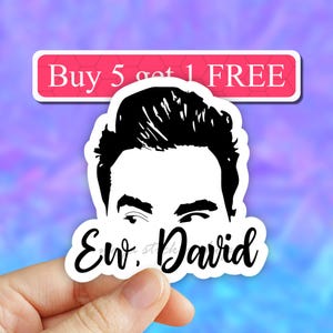 May include: A black and white sticker with a cartoon drawing of a man's face with the text "Ew, David" below. The sticker has a pink and white background with the text "Buy 5 get 1 FREE" above the sticker.