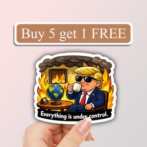 May include: A cartoon sticker featuring a man in a suit and sunglasses, sipping from a mug while sitting in a burning room. A globe and small picture frame are on a table. Text reads "Everything is under control."
