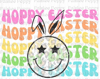 May include: A colorful graphic design with the words "Hoppy Easter" in a retro font. The design features a smiley face with star eyes and bunny ears. The background is a repeating pattern of the words "Paislee Poppy".