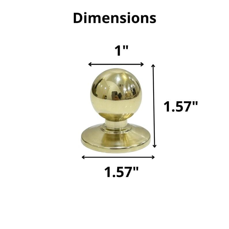 K&ouml;nnte beinhalten: Ein goldfarbener Schrankknopf mit kugelf&ouml;rmiger Oberseite und kreisf&ouml;rmiger Basis. Der Knopf ist 2,54 cm breit und 4 cm hoch. Das Wort "Dimensions" ist &uuml;ber dem Knopf aufgedruckt.