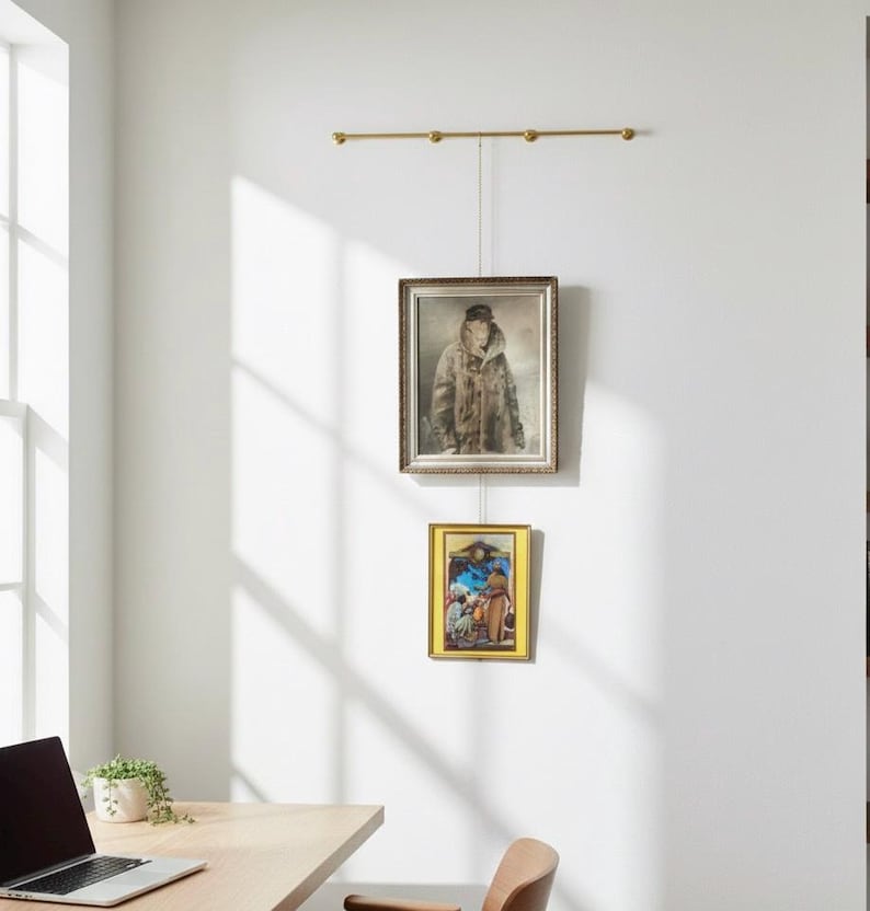 A brass gallery rail mounted for pictures