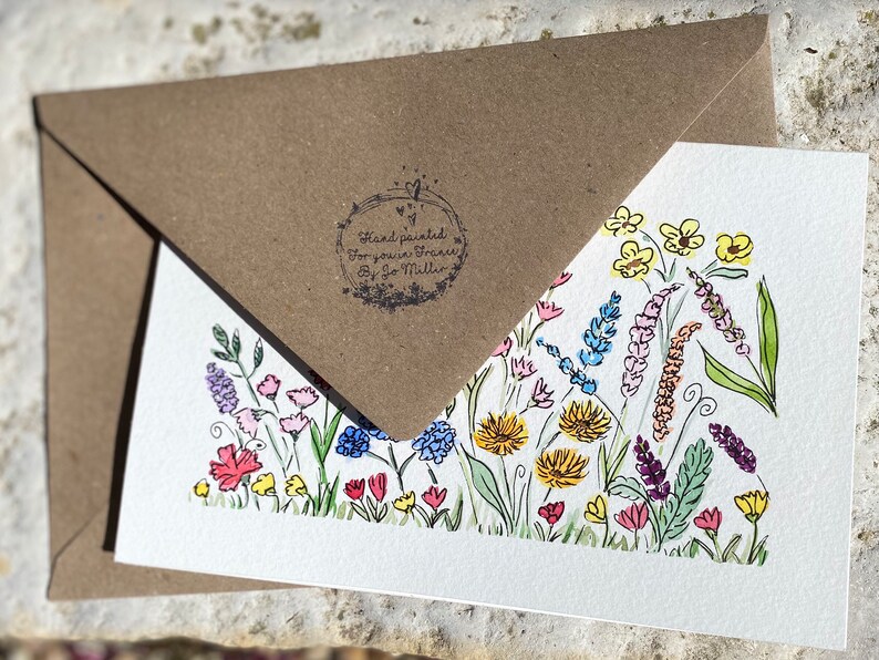 May include: A hand-painted card with a colorful floral design. The card is signed "Hand painted for you, Frances by Jo Miller".