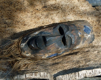 African mask, wood sculpture.