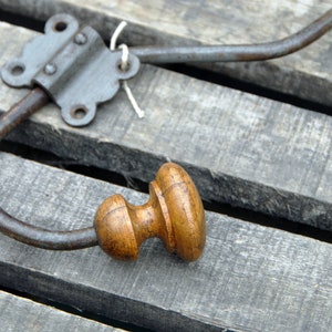 Old vintage metal and wood coat rack with its clip. image 4