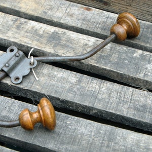 Old vintage metal and wood coat rack with its clip. image 2