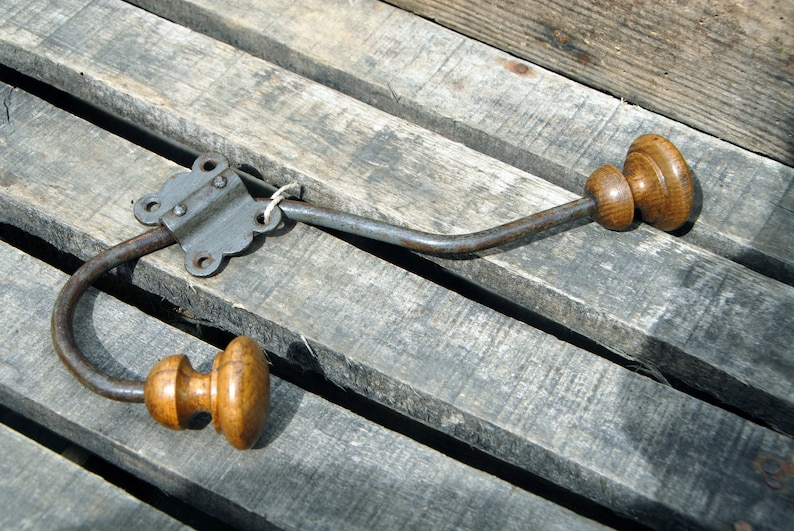 Old vintage metal and wood coat rack with its clip. image 1