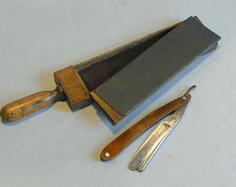 Vintage straight razor and its wooden case.