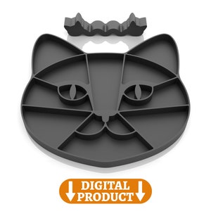 May include: A black silicone cat-shaped mold for making treats or crafts. The mold has a detailed design with eyes, nose, and whiskers.
