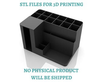 May include: A matte black desk organizer with multiple square compartments of varying heights and a large rectangular slot on the left side. The text STL FILES FOR 3D PRINTING and NO PHYSICAL PRODUCT WILL BE SHIPPED is displayed in teal.