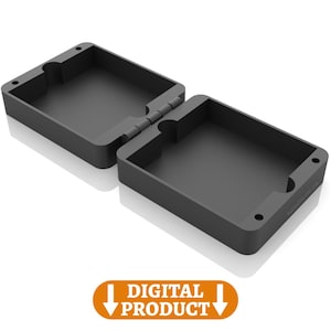 Può includere: Scatola rettangolare nera aperta, con cerniera. La scatola è realizzata in materiale opaco e ha angoli arrotondati. Le parole "DIGITAL PRODUCT" sono visualizzate in uno striscione arancione sottostante.