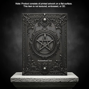 May include: A dark gray book cover with ornate, gothic-style detailing. A pentagram is centered within a circular frame. The words "Personalized Text" are below the pentagram. The product consists of printed artwork on a flat surface.