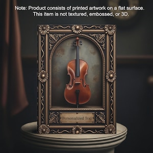 May include: A framed print of a cello in a gold frame with a black background. The frame has ornate details and a plaque that says "Personalized Text".