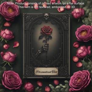 May include: A black framed illustration of a skeletal hand holding a red rose. The frame has ornate details and a skull at the top. The background is a dark gray. The text "Personalized Text" is on a white label at the bottom of the frame.
