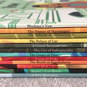 May include: A stack of colorful books with titles related to the Indian epic, the Mahabharata. The titles include "Bhishma's Vow", "The Princes of Hastinapur", "The Ashram of Dronacharya", "The Palace of Lac", "A Grand Swayamvara", "The City of Indraprastha", "The Game of Dice", "Living in Exile", "The Battle at Kurukshetra", "Death of Abhimanyu", "Karna's Last Battle", and "A New Beginning".