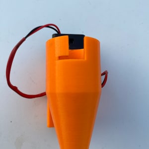 May include: Orange 3D printed motor mount with a black motor and red and black wires.
