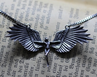 Female angel jewelry necklace pendant. Woman with wings figure angel silver necklace chain. Woman wings angel jewelry silver statue feminism