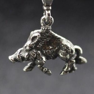 Wild boar figurine jewelry pendant. Animalistic volume figure of wild boar. Wild pig jewelry pendant. Wild nature animal figure of boar