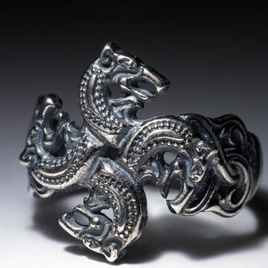 Wolf heads celtic european style jewelry ring. Solar pattern head of wolf. Figure of wolf north nordic jewelry viking style celtic ethnic