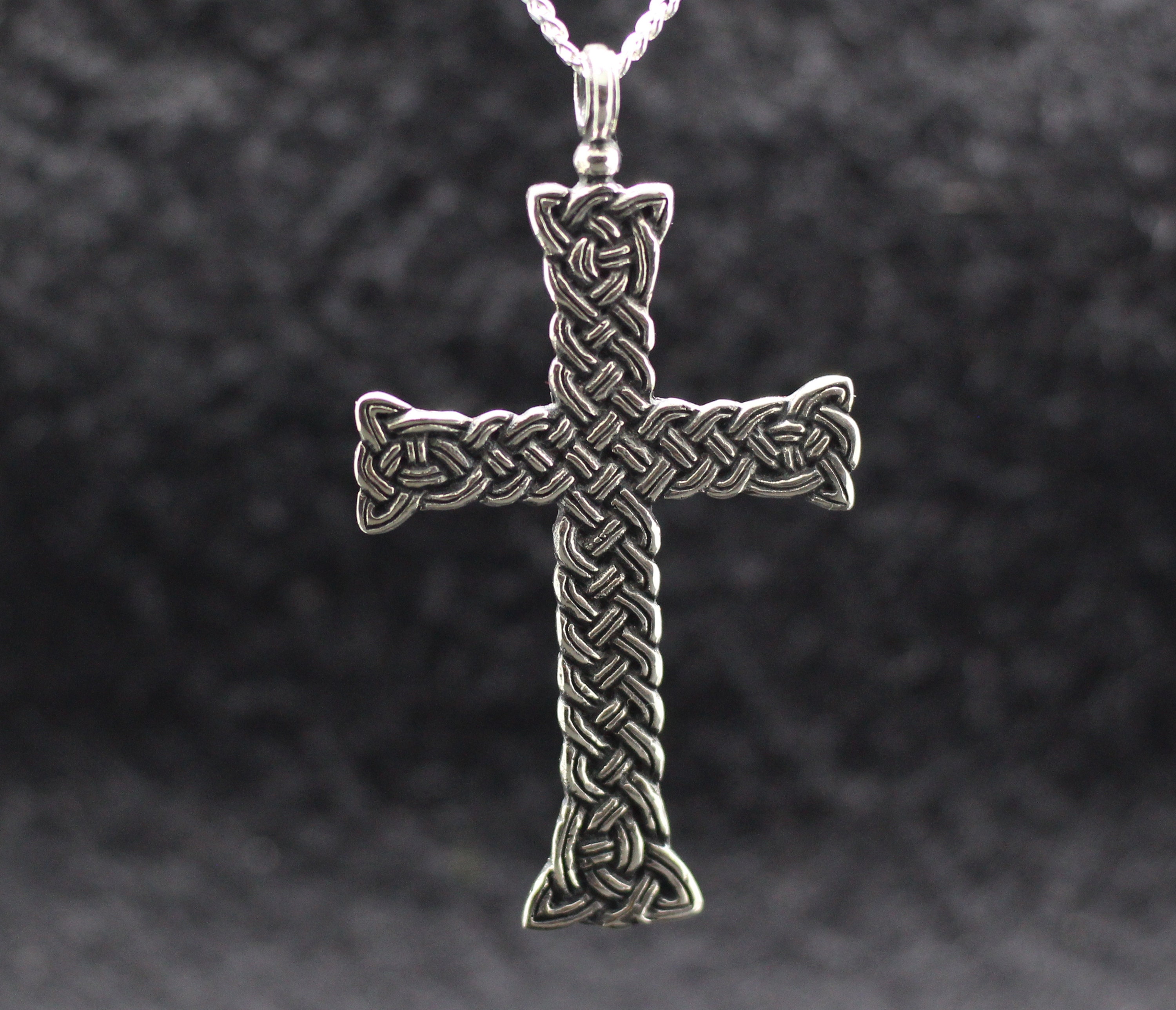 Big Celtic knot ornamental cross jewelry pendant. Celtic curls medieval style cross. Middle-ages style celtic patterns jewelry. Patterned