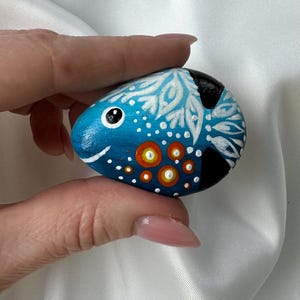 Hand painted stone Funny Fish. Original acrylic painting on the stone. Hand-painted small rock. Happy fish painting on the stone.