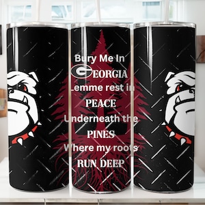May include: A black and red tumbler with a white bulldog graphic and the text "Bury Me In Georgia Lemme rest in Peace Underneath the Pines Where my roots RUN DEEP".