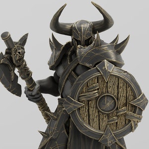 May include: A detailed miniature figurine of a warrior with a horned helmet, holding a battle axe and a shield. The figure is made of a dark grey plastic with gold accents. The shield is made of wood and has a circular design. The figure is standing on a base with the text "UNCHAINED VOLUME II" printed on it.