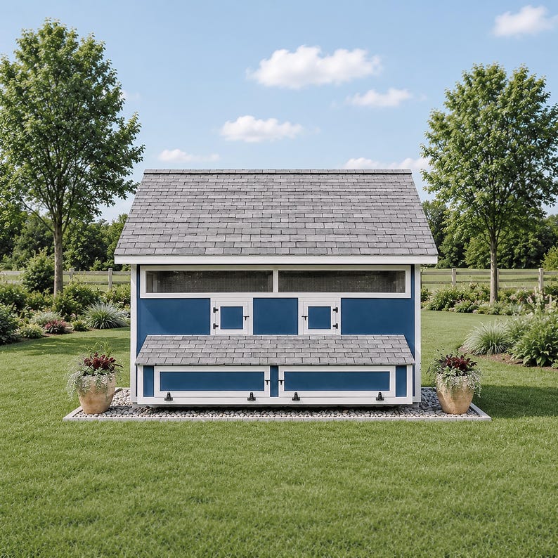 May include: A blue and white chicken coop with a gray shingled roof, featuring two small square doors, two long horizontal windows, and a large lower hinged panel. The structure sits on a rectangular stone base with potted plants on each side.