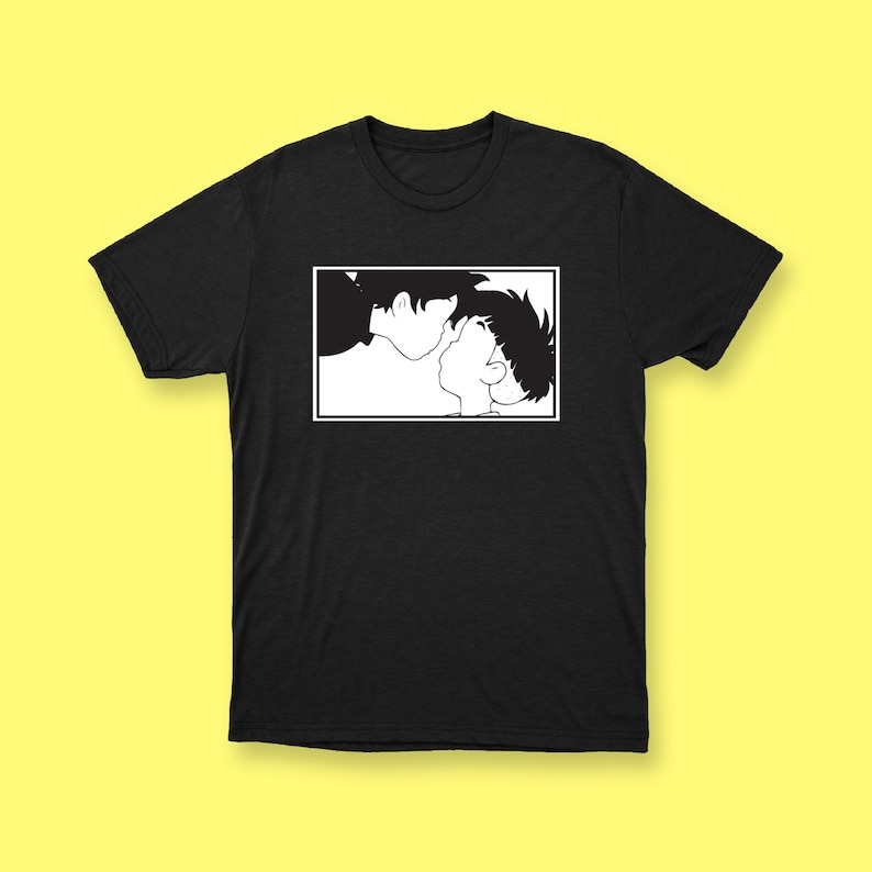 May include: Black and white illustration of two people looking at each other. The image is printed on a black t-shirt.