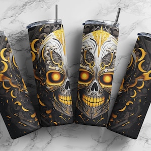 May include: Four stainless steel tumblers with a black and gold design featuring a skull with glowing eyes. The skull is surrounded by intricate patterns and details.