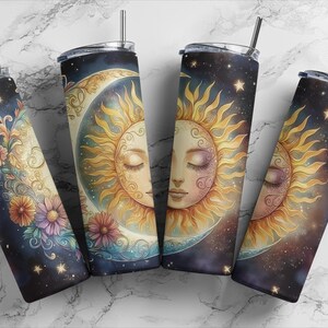 May include: Four stainless steel tumblers with a celestial design. Each tumbler features a crescent moon and a sun with a closed eye, surrounded by stars. The sun has a detailed face with a soft pink and yellow colour scheme.