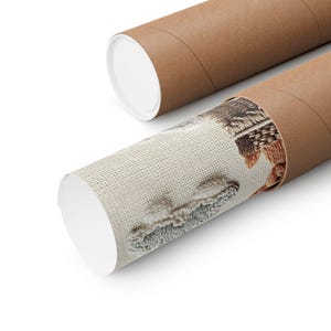 May include: Two brown cardboard poster tubes, one open, revealing a rolled-up print with a textured, beige background and a detailed, colorful design. The print features a close-up of a detailed, colorful design. The tubes are set against a white background.