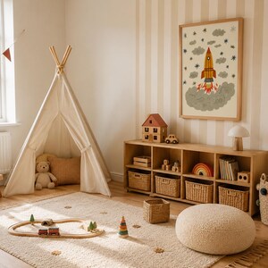 May include: A children's playroom featuring a cream-colored canvas teepee, a wooden storage unit with woven baskets, a framed rocket ship wall print, a wooden train set on a textured rug, a round cream pouf, and a woven basket with colorful pom-poms.