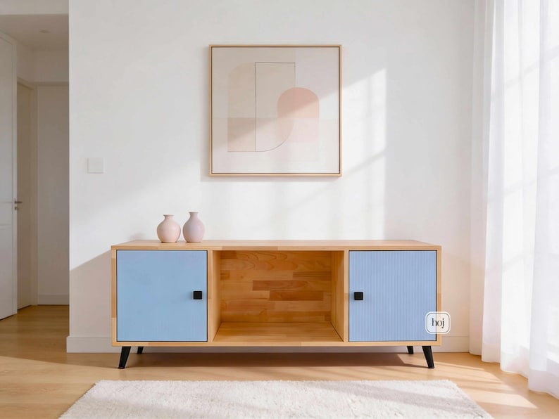 Aura blue media console with fluted doors, gold knobs, and open shelf storage