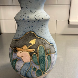 Alevloza Mexican pottery mountains, cactus, working man with sombrero and hand tool