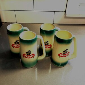 4 vintage O’Keefe glazed pottery mugs