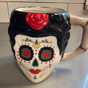 Day of the Dead type black, white and red skull head, makeup and red heart eyes with stitches mug