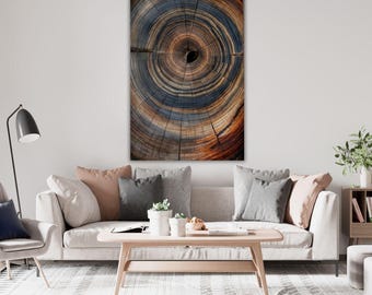May include: A rectangular wall art print featuring a high-resolution cross-section of a tree trunk. The image displays concentric growth rings in shades of deep blue, charcoal gray, and warm brown, radiating from a dark central point.