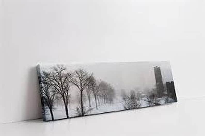 a picture of a snowy landscape on a white wall