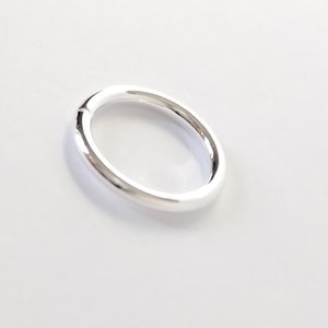 May include: A silver ring with a smooth, polished finish.