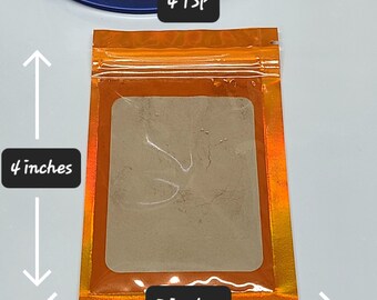 May include: A small orange resealable pouch with a clear window, containing a light brown powder. The pouch measures 4 inches tall and 3 inches wide. The text "4 TSP" is printed on the top of the pouch.