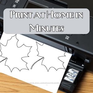 May include: A black printer is shown with a sheet of paper featuring a leaf design. The text "PRINT AT HOME IN MINUTES" is displayed on the image. The paper is coming out of the printer.
