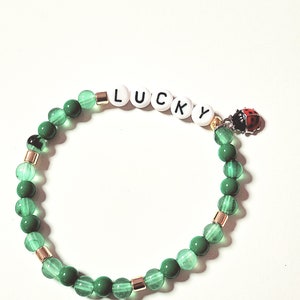 Sweet beaded bracelet &quot;Lucky&quot; green with a sweet ladybug pendant