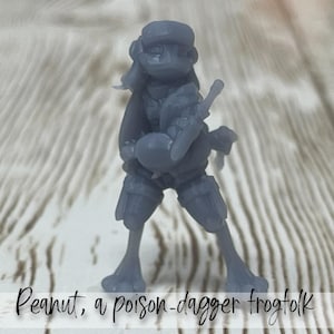 Peanut, a poison-dagger frogfolk | Male | Froggie | Rogue | Primed or Unprimed | D&D Dungeons and Dragons 5e | Pathfinder-