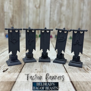 May include: Five dark gray faction banners with unique symbols, each mounted on a square base. The banners are displayed on a light wood surface. The text "Faction Banners" and "BELDRAD'S BAG OF BEASTS" are at the bottom.