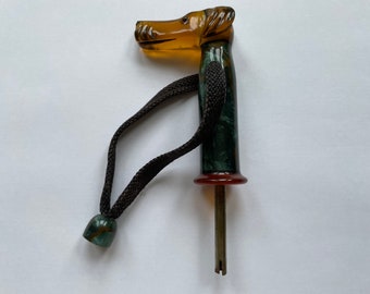 Mid 20th Century plastic umbrella/parasol handle with long-snouted dog design